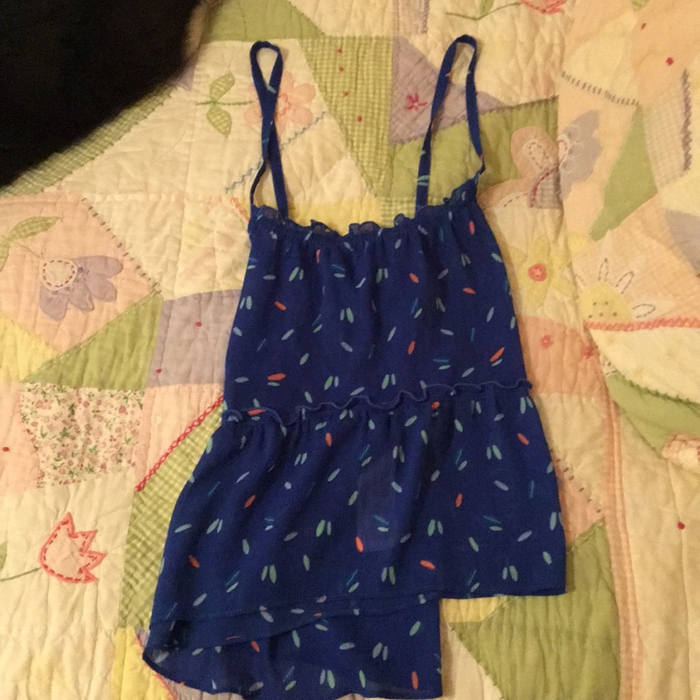 Blue tank top with surf boards on it